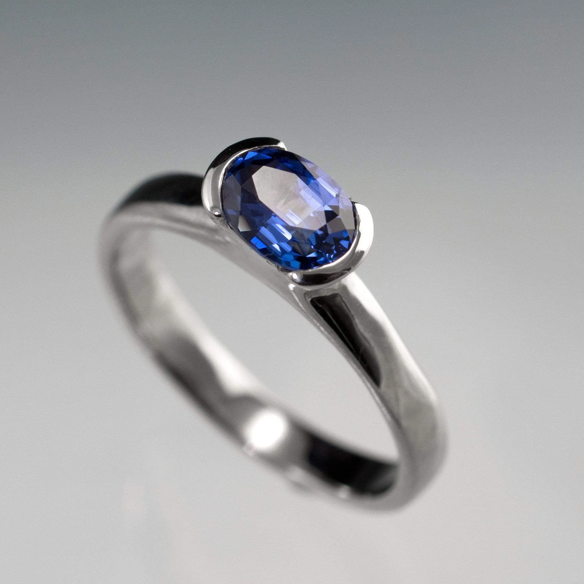 Chatham Lab Created Oval Blue Sapphire Half Bezel Solitaire Engagement Ring